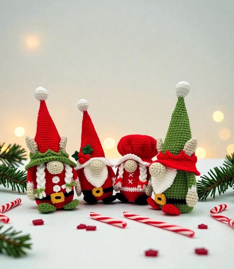 Four crochet Christmas gnomes surrounded by candy canes and pine branches with soft holiday lights in the background, including Santa, Mrs. Claus, and two elf gnomes in red, green, and white outfits, handmade amigurumi figures featured for the downloadable PDF crochet pattern.