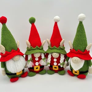 Four festive crochet elf gnomes in red, green, and white Christmas outfits with tall hats, braids, and belts, handmade amigurumi figures shown for the downloadable PDF crochet pattern.