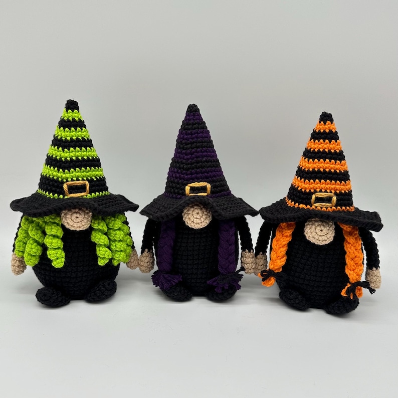 Crochet witch gnome pattern featuring three Halloween amigurumi gnomes with striped witch hats, green, purple, and orange braided hair, handmade Halloween decor.