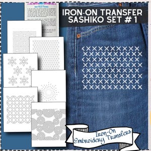 May include: Iron-on Sashiko transfer set for visible mending and denim repair. The image shows a pair of blue jeans with white cross-stitch embroidery. The set includes various patterns for slow clothing and repair culture.