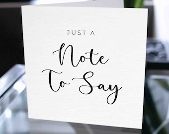 Puede incluir: Una tarjeta blanca con texto negro que dice "Just a Note to Say".