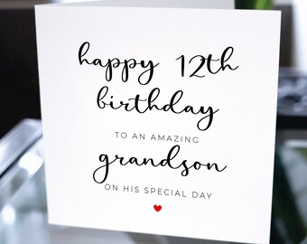 May include: White card with black text that reads "happy 12th birthday to an amazing grandson on his special day" with a small red heart at the bottom.