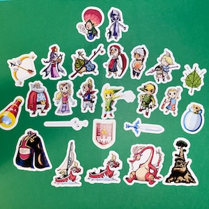 May include: A set of 20 colorful stickers featuring characters from the Legend of Zelda video game series. The stickers are printed on white paper and have a glossy finish. The characters include Link, Zelda, Ganondorf, and many others.