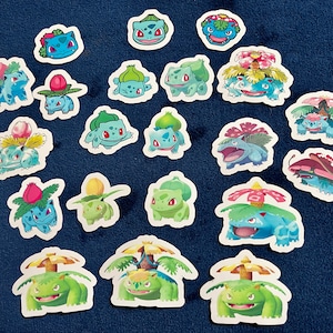 May include: A collection of 20 colorful Pokemon stickers featuring various characters from the franchise. The stickers are printed on white paper and feature a variety of poses and expressions.