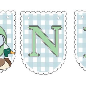 May include: A banner set with the word "ONE" in green letters. The letter "O" features a cartoon duck with a party hat and balloons. The background is a light blue gingham pattern with a scalloped edge.