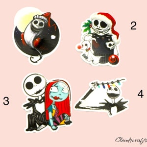 May include: Four stickers featuring characters from The Nightmare Before Christmas. Designs include Jack Skellington in a Santa hat, Jack and Sally, and Jack with Christmas lights. The stickers are white with colourful illustrations.