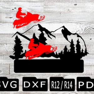 May include: Black silhouette of two snowmobiles driving through a mountain range with pine trees. The snowmobiles are red and the riders are wearing helmets. The image includes the text "SVG DXF R12/R14 PDF".