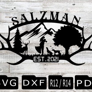 May include: Black and white silhouette of a couple standing in front of a mountain range with a deer and two dogs. The text "SALZMAN EST. 2021" is above the couple. The image is on a woodgrain background.