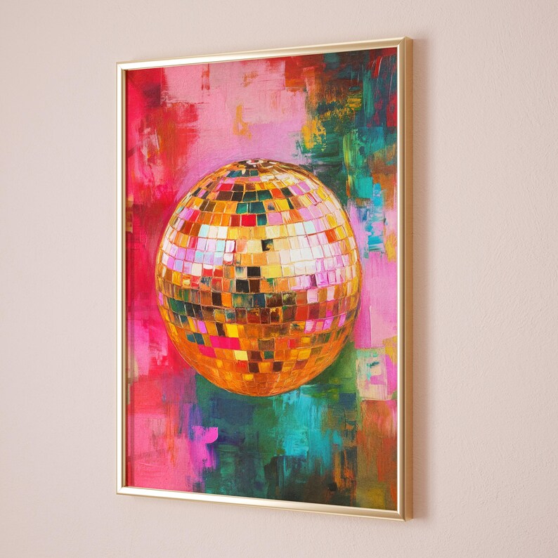 May include: A gold disco ball with mirrored tiles is painted on a canvas with pink, green, and blue abstract brushstrokes. The canvas is framed in gold.