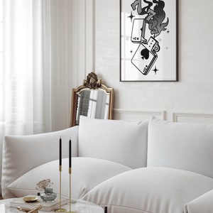 May include: A black and white illustration of a lighter with flames and playing cards, printed on a white background and framed in a black frame.