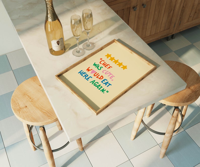 May include: A framed print with a yellow background and the text "Chef was cute, would eat here again." with five yellow stars and a pink heart.