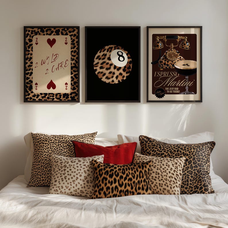 May include: Three framed prints with a leopard print design. The first print features a playing card with the text "2 Wild 2 Care". The second print features a leopard print 8-ball. The third print features a vintage phone with the text "Espresso Martini, You just had to be there!"