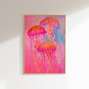May include: A framed print of three pink jellyfish with long, flowing tentacles against a pink and blue background.