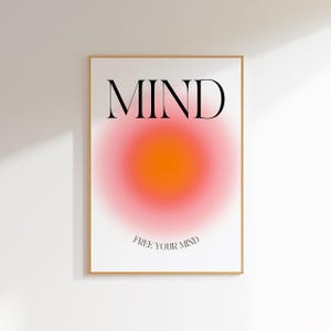 May include: A minimalist poster featuring the word "MIND" in bold black text and a large, blurred, orange and pink circle in the centre. The text "FREE YOUR MIND" is written in smaller black text below the circle.