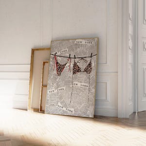 May include: A framed print of a newspaper page with the word "NEW YORK" printed repeatedly. Two leopard print bikinis are hanging on a clothesline with red string.