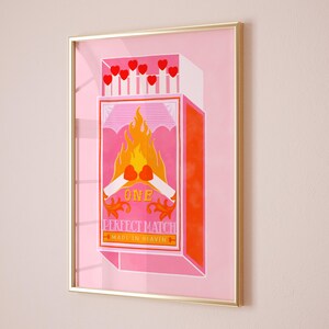 May include: A pink and orange matchbox with a flame and two crossed matches. The box says "One Perfect Match Made in Heaven".