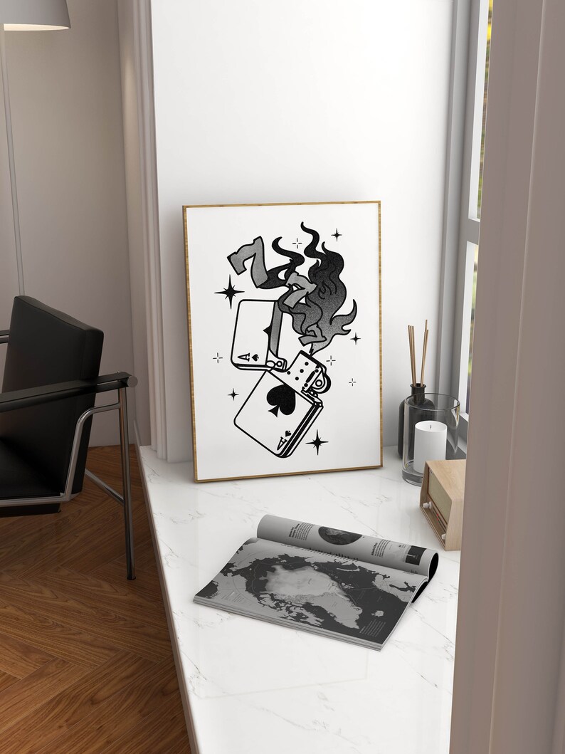 May include: A black and white illustration of a lighter with flames coming out of it. The lighter is on top of two playing cards, an ace of spades and a seven of diamonds. The illustration is surrounded by stars.