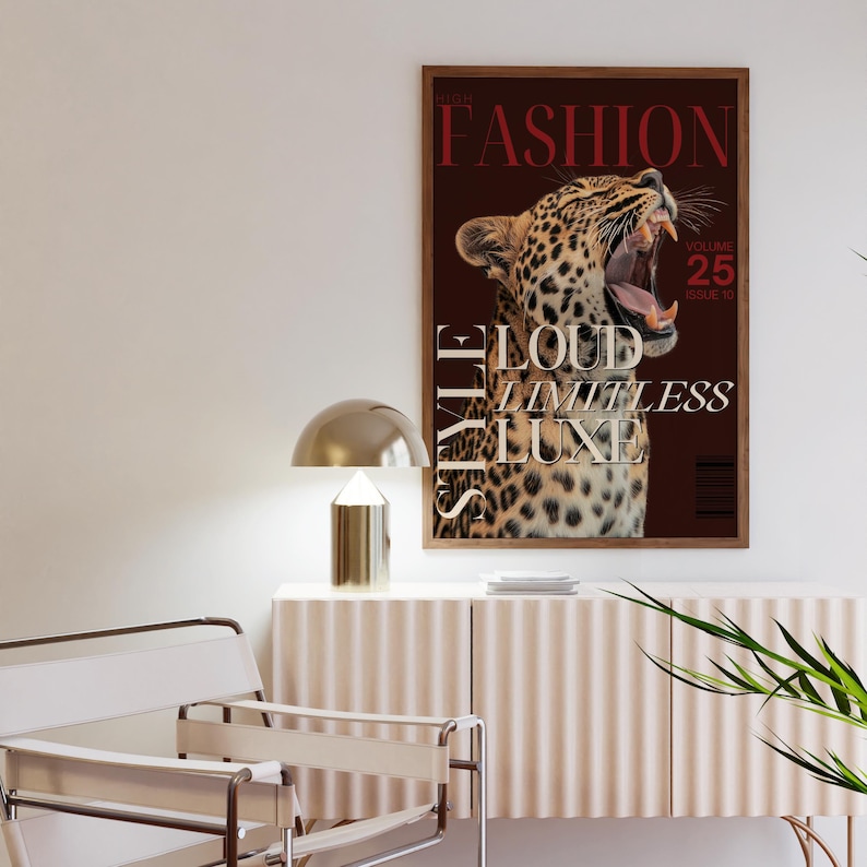 May include: A magazine cover with a leopard roaring with its mouth open. The magazine is titled "The Fashion Style" with the words "Loud, Limitless, Luxe" in white text. The magazine cover is brown with a red border.