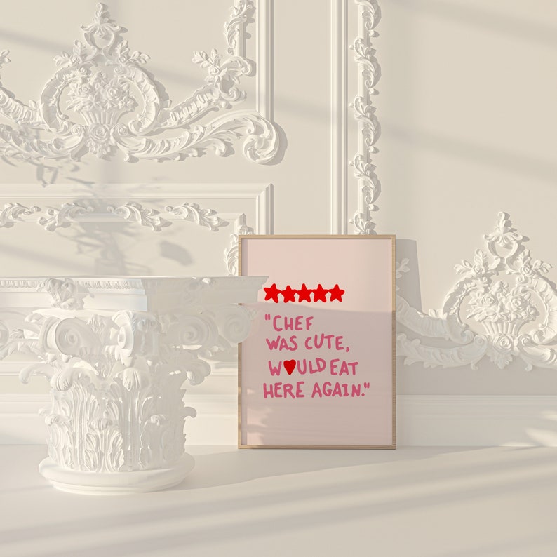May include: A pink and white framed print with a five-star rating and the text "Chef was cute, would eat here again."