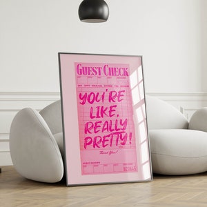 May include: Pink framed poster with a pink guest check that says "You're like. Really pretty!" with the words "Guest Check" at the top and "Thank You!" at the bottom.