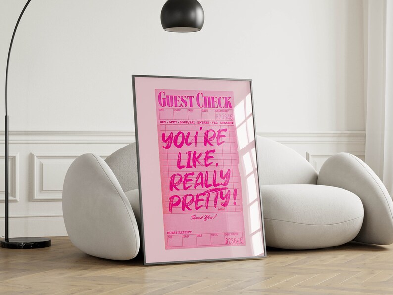 May include: Pink framed poster with a pink guest check that says "You're like. Really pretty!" with the words "Guest Check" at the top and "Thank You!" at the bottom.