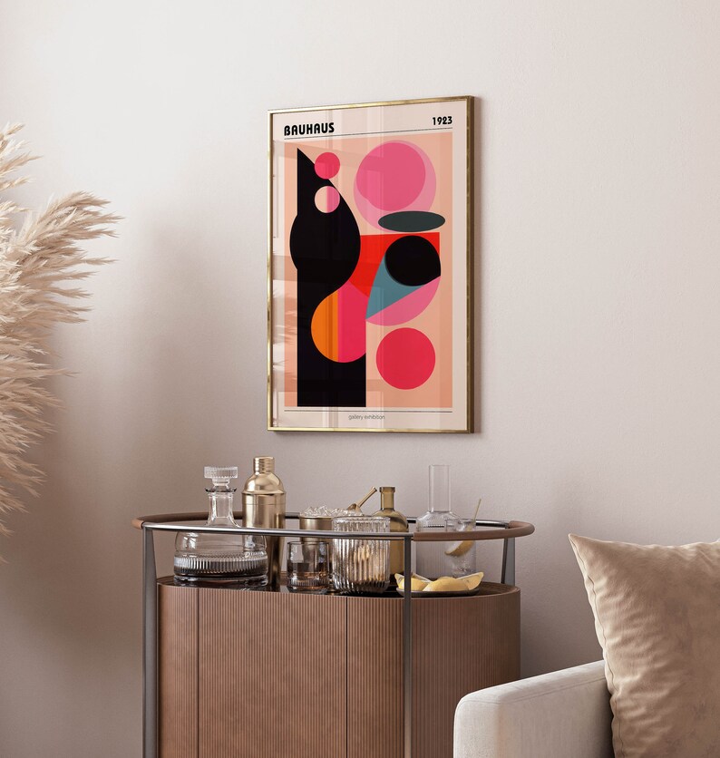 May include: A framed poster featuring a geometric design in black, red, pink, and blue. The poster has the text "BAUHAUS 1923" at the top and "gallery exhibition" at the bottom.
