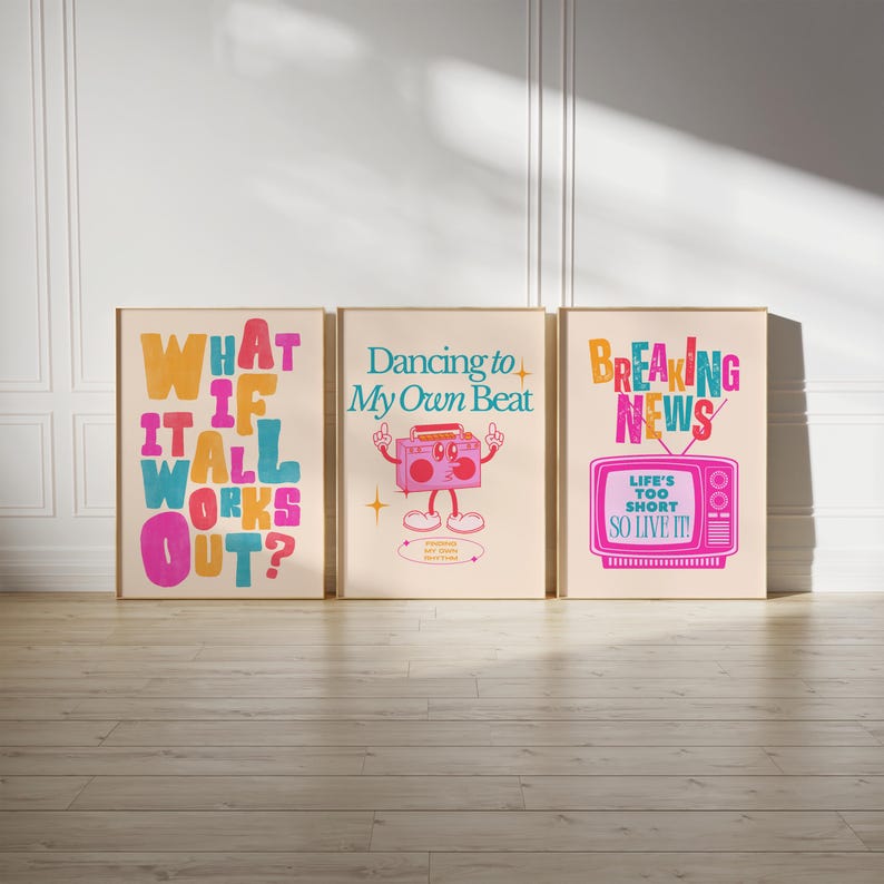 May include: Three framed prints with colorful text and illustrations. The first print says "What if it all works out?" The second print says "Dancing to my own beat" and features a cartoon boombox. The third print says "Breaking News" and features a cartoon television with the text "Life's too short, so live it!"