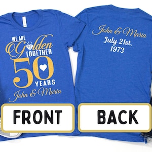 May include: Two royal blue t-shirts with gold text. The front shirt says "We are Golden Together 50 Years John & Maria". The back shirt says "John & Maria July 21st, 1973".