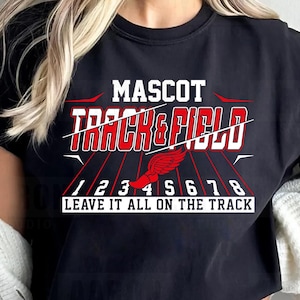May include: Black t-shirt with the words "MASCOT TRACK & FIELD" in white and red. Below the text are the numbers 1 through 8, and the phrase "LEAVE IT ALL ON THE TRACK". The shirt has a crew neck and short sleeves.