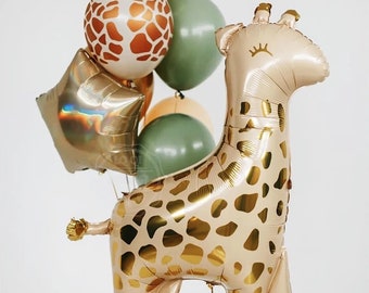 May include: A collection of balloons in a safari theme. The arrangement includes a large giraffe-shaped balloon with gold spots, a gold star-shaped balloon, and several round balloons in shades of green, tan, and white with brown spots.