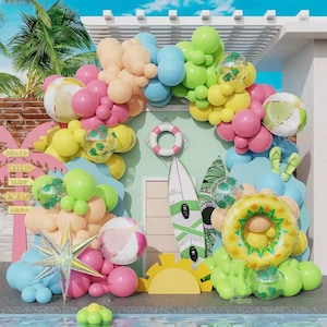 May include: A colourful beach-themed display with balloons in pink, yellow, blue, and green. The arrangement includes beach balls, a life preserver, surfboards, and a pineapple-shaped float, creating a festive summer scene.