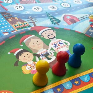 Op de afbeelding: Een kerst-thema bordspel met drie pionnen: geel, rood en blauw. De pionnen staan op een groen speelbord met een feestelijke illustratie van een gezin in winterkleding.