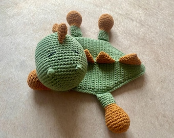 Cuddly dinosaur crocheted with love