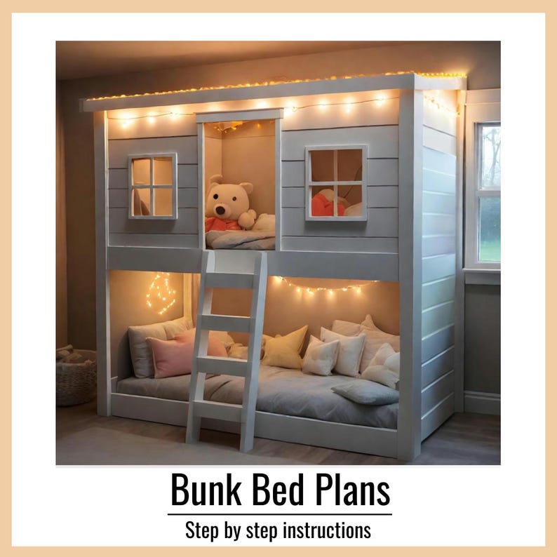 May include: A white wooden bunk bed designed like a house with a ladder, two windows on the top level, and string lights. The bed features multiple pillows in shades of pink, white, and yellow, with a teddy bear sitting in the top bunk area.
