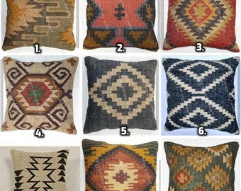 May include: Nine different square throw pillows with various geometric patterns in shades of brown, beige, black, red, and blue. The pillows are numbered 1 through 9.