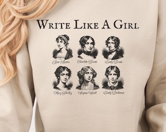 May include: A beige sweatshirt with the text "Write Like A Girl" above portraits of six female authors. The portraits are in black and white and include Jane Austen, Charlotte Brontë, and Emily Brontë.