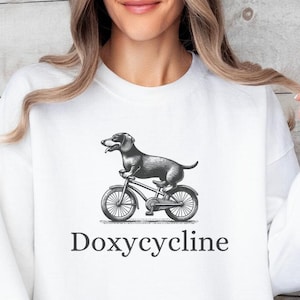 Doxycycline Pharmacy Pun Sweatshirt, Dachshund On Bicycle, Pharmacists Shirt, Veterinary Funny Shirt, Vet Tech Sweatshirt, Dachshund Shirt