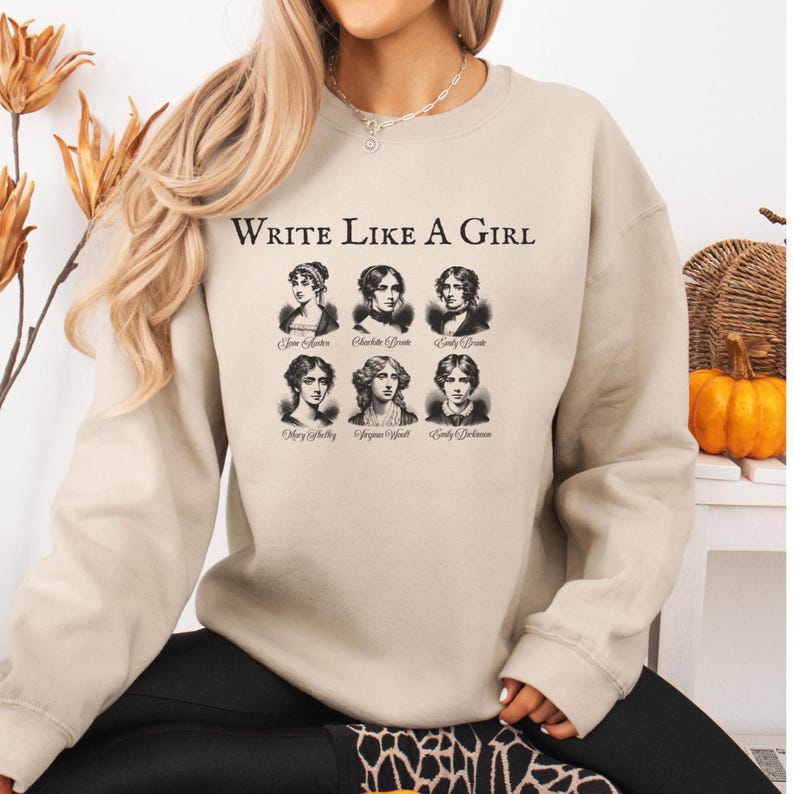 the "Write Like a Girl" sweatshirt is a must-have addition to your wardrobe. This cozy, stylish garment celebrates the literary monarchs who have shaped the world of literature with their groundbreaking works. Featuring the iconic names of the Brontë sisters, Jane Austen, Mary Shelley, Emily Dickinson, and Virginia Woolf, this sweatshirt is a tribute to the enduring influence and brilliance of these pioneering women.
