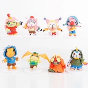 May include: Set of eight colorful cartoon character figurines. The characters are from the Digimon anime series. The figurines are made of plastic and are about 2 inches tall.
