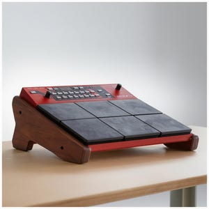 May include: A red electronic drum pad with black pads and a wooden stand. The drum pad has buttons, knobs, and a small display screen. The wooden stand is a dark brown colour.