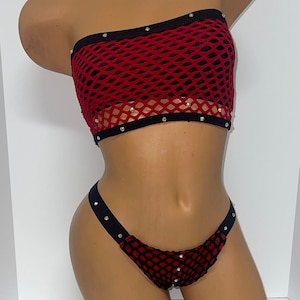 May include: Red and black mesh lingerie set with silver studs. The top is a strapless bandeau style and the bottom is a cheeky cut.