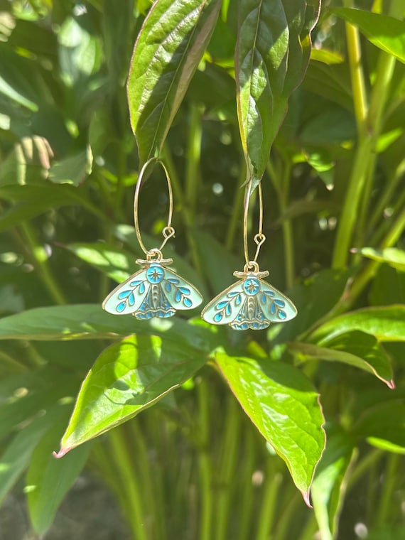 Hoop earrings in gold with light green blue charm butterfly moth magical fairy