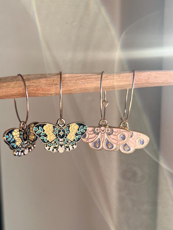 Hoop earrings in gold magical fairy moth butterfly charm