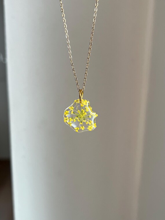 Necklace pendant made of real yellow flowers with gold clasp