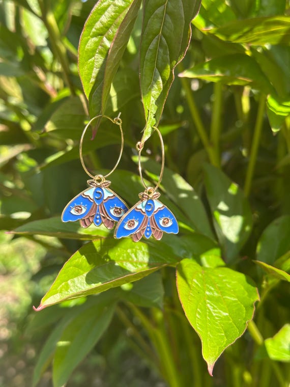 Hoop earrings in gold with blue charm butterfly moth magical fairy