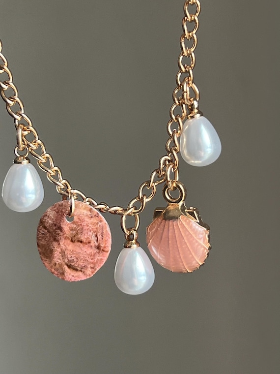 Golden necklace with shell plate charm and white artificial pearls, adjustable length