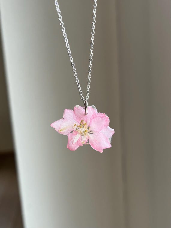 Necklace pendant made of a real pink mallow blossom with silver clasp