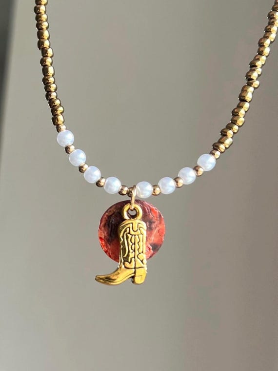 Cowgirl necklace with boot charm boots white and gold beads red shell detail