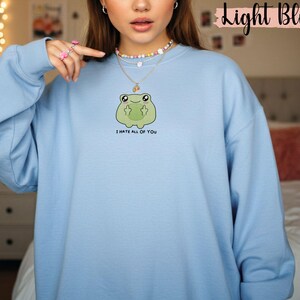 Frog flipping the bird with the text i hate all of you in black below Embroidered Sweatshirt Funny Frog Gift Goblincore Frog Lover Gift Cool Frog Outfit Frog Retro Meme Green Frog Embroidered Crewneck