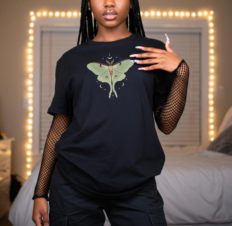Black T-shirt with luna moth and crescent moon and celestial stars